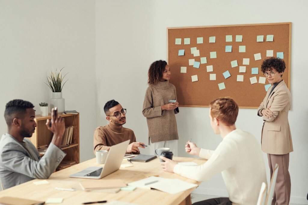 Employees in a meeting discussing scalable business growth strategies.